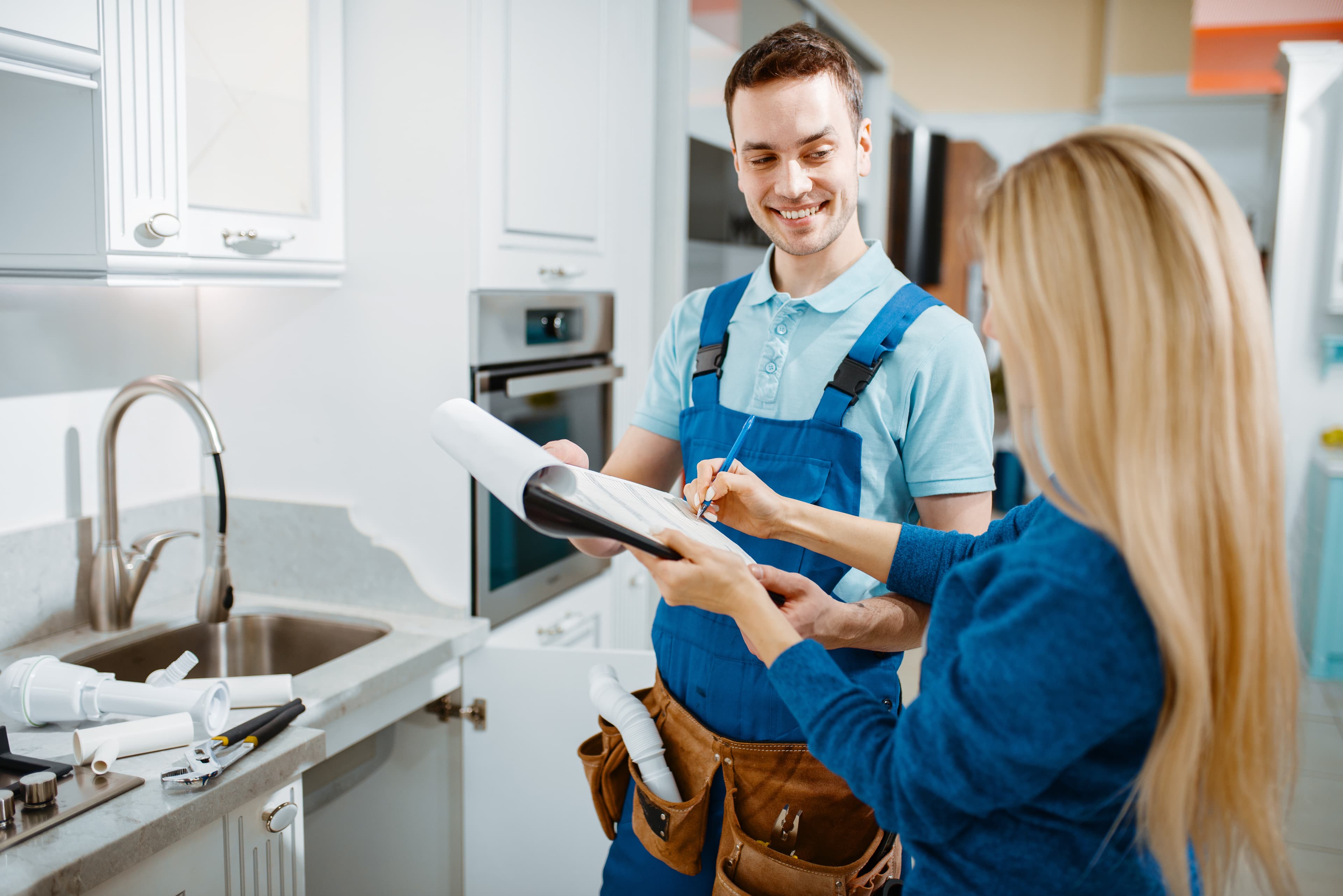 Technician reviewing water test results with homeowner